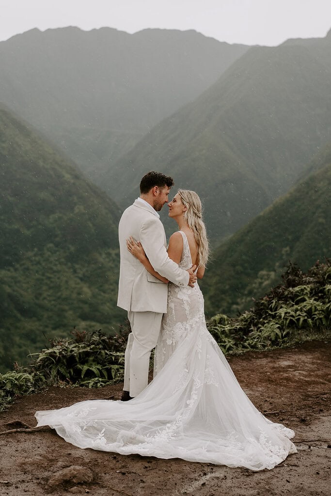 newlyweds hugging on a mountain during their Maui elopement.