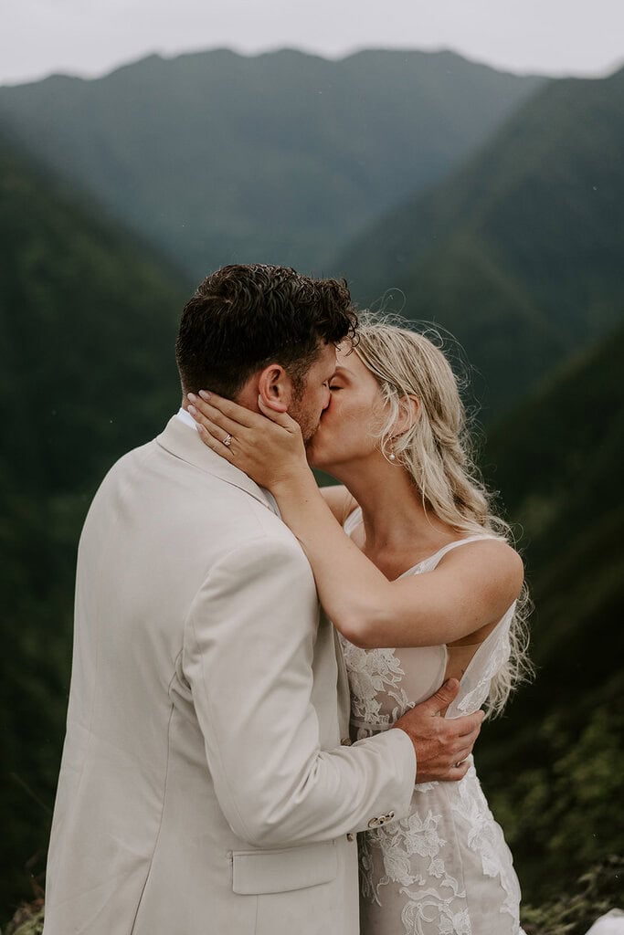 newlyweds kissing on a mountain during their Maui elopement.