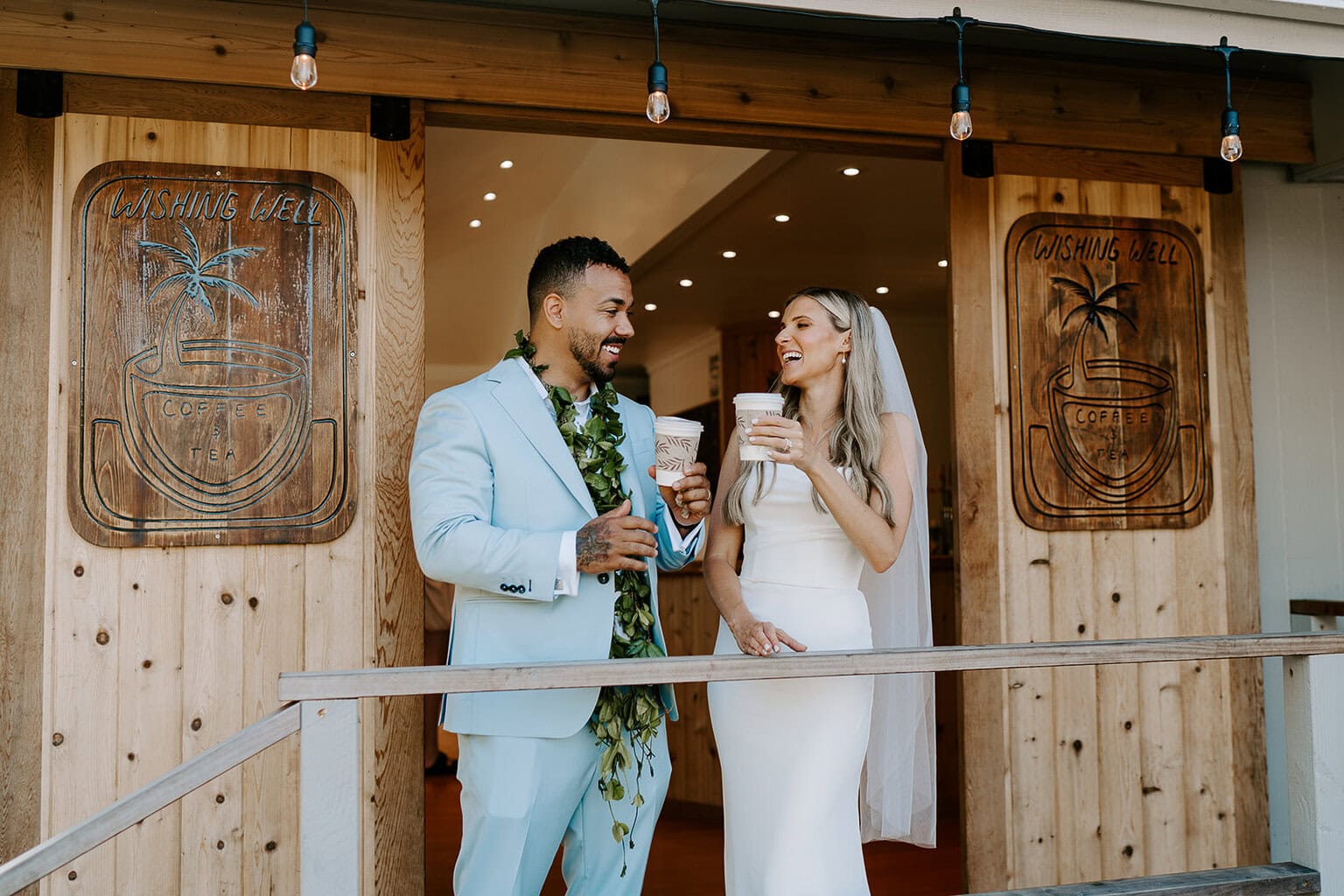 newlyweds grabbing coffee in wedding attire.