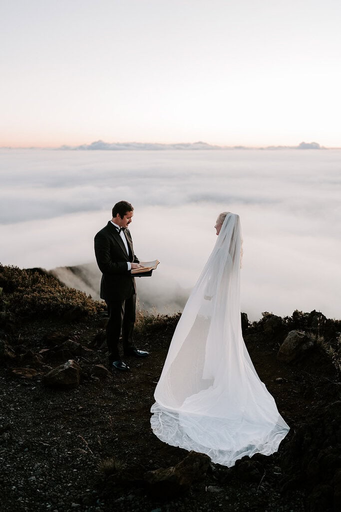 newlyweds exchanging vows during their Haleakalā wedding.