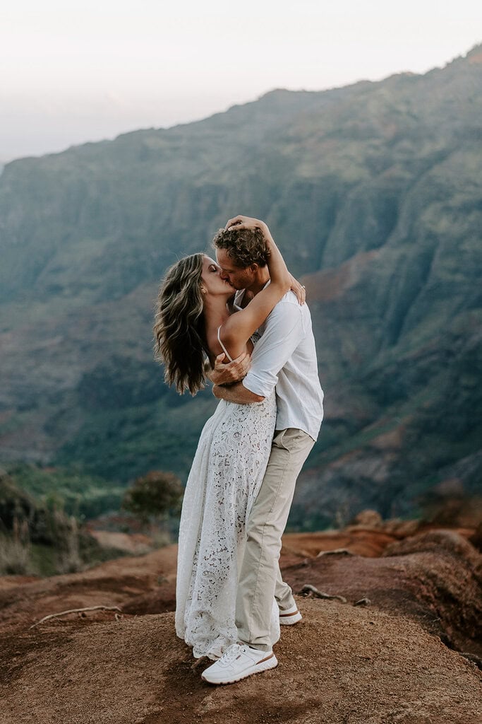 newlyweds kissing during golden hour as they elope in Waimea Canyon